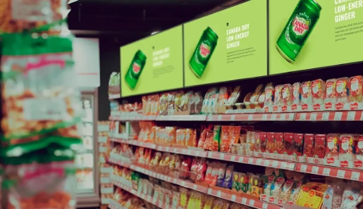 Dynamic shelf edge display increases shopper dwell time versus static signage Animated shelf-edge digital signage screen capturing shopper attention at point of purchase